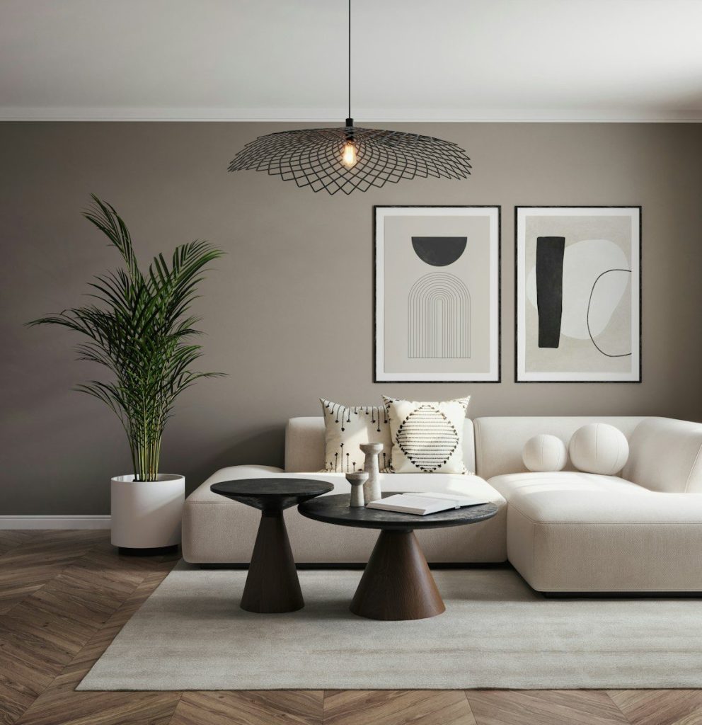A living room with a white couch and a table